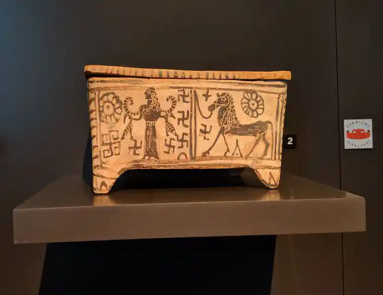Boeotian small box from Thebes with painted goddess, lion, swastikas and solar symbols late 7th century BC Boeotian small box from Thebes with painted goddess, lion, swastikas and solar symbols late 7th century BC